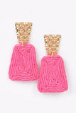 straw earrings with a gold accent
