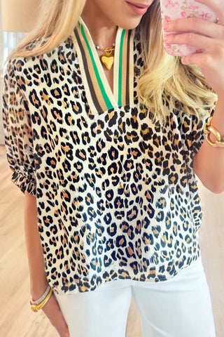 Leopard print top with green accent trim