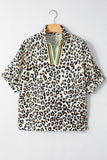 Leopard print top with green accent trim